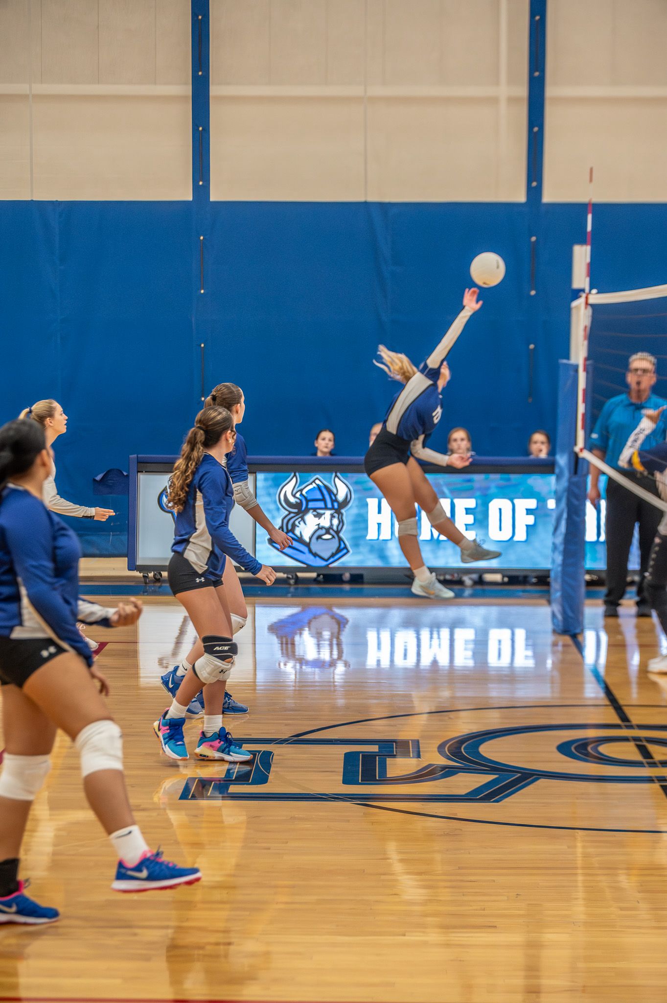 Volleyball player serving during a game